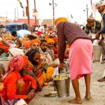 hindu-pilgrims-receiving-holy-prasad-kumbh-mela-2013-india-9546095386